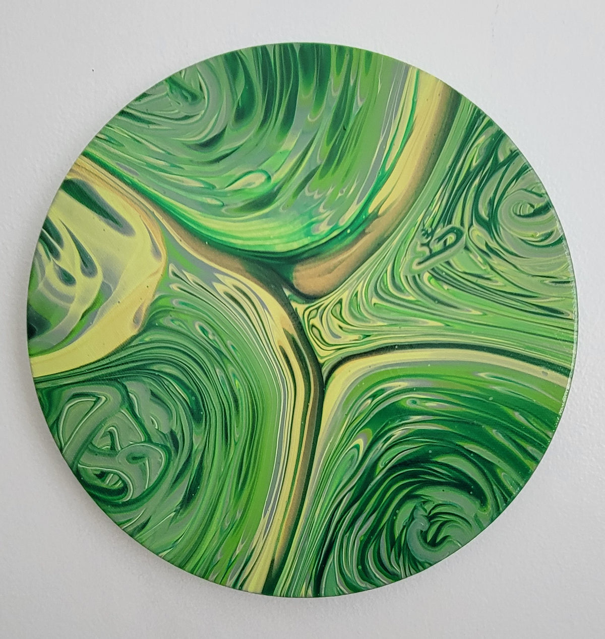 Forest in Motion, 10-inch round acrylic pour with layered green and yellow current